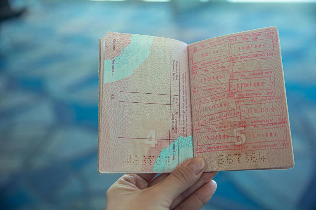 Passport with Schengen travel stamps